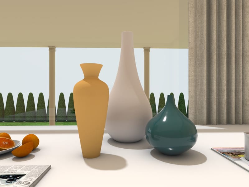 Vases on a table with a garden behind.