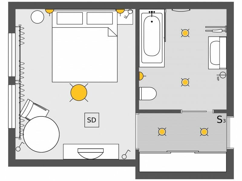 Electrical plan for a hotel room showing lighting fixtures, switches, outlets, and a smoke detector placed around the bed, seating area, and bathroom.