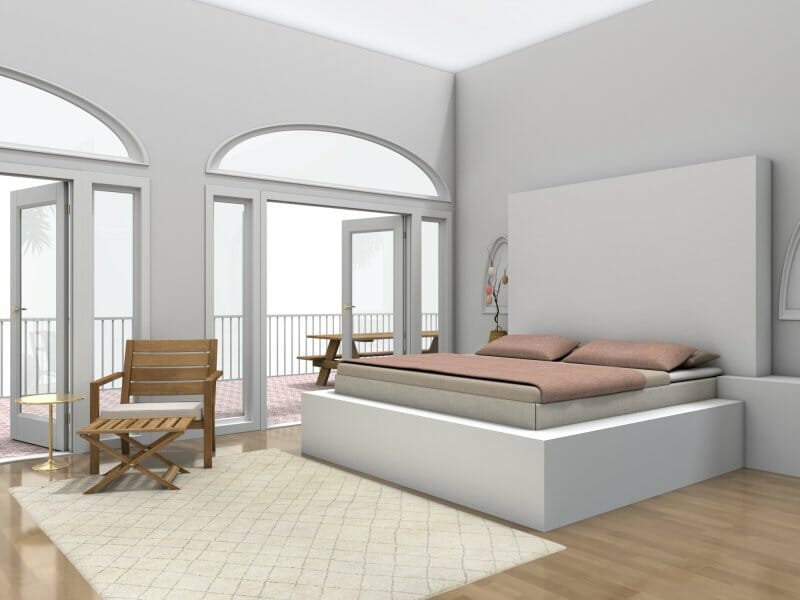 3D Photo of a white master bedroom with a balcony. The bed has pink bedding. There is a white rug on the floor next to a wooden chair and the bed.