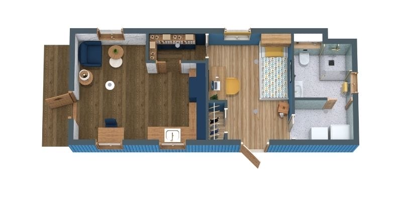 3D floor plan of a compact single-story shotgun-style house with a living room and kitchen at the front, featuring dark wood flooring. The center of the home includes a bedroom with patterned bedding and light wood floors. At the rear is a bathroom with a walk-in shower and laundry area. Exterior doors open from both the living room and bedroom.