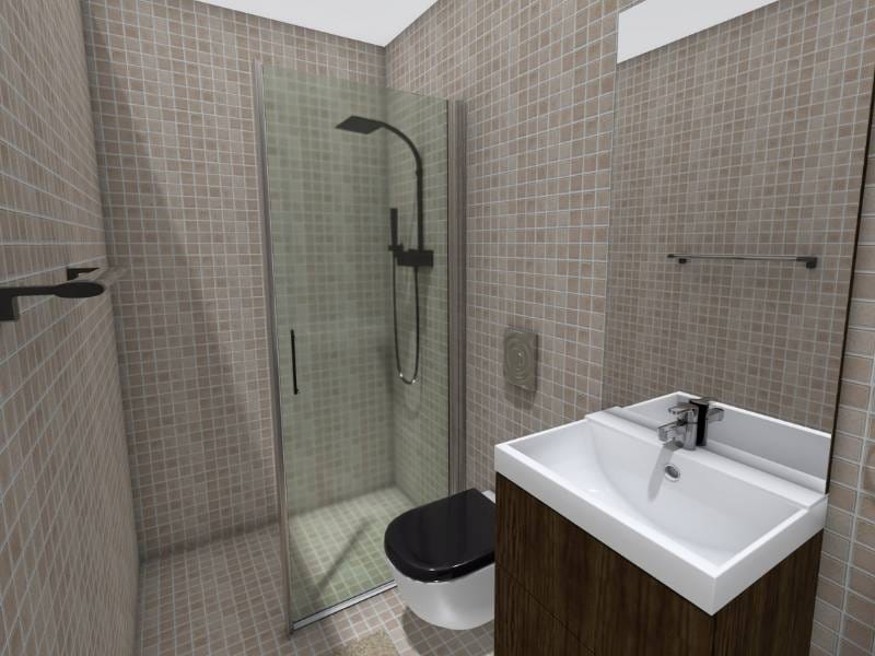 3D Photo of a small bathroom with a sink, shower, and a wall-hung toilet. The walls and floors are the same beige neutral colored tiles. The sink has a dark wooden cabinet. The shower has a one wall glass door and black showerhead. The toilet lid is also black.